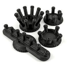 Set of black plastic components on a white background